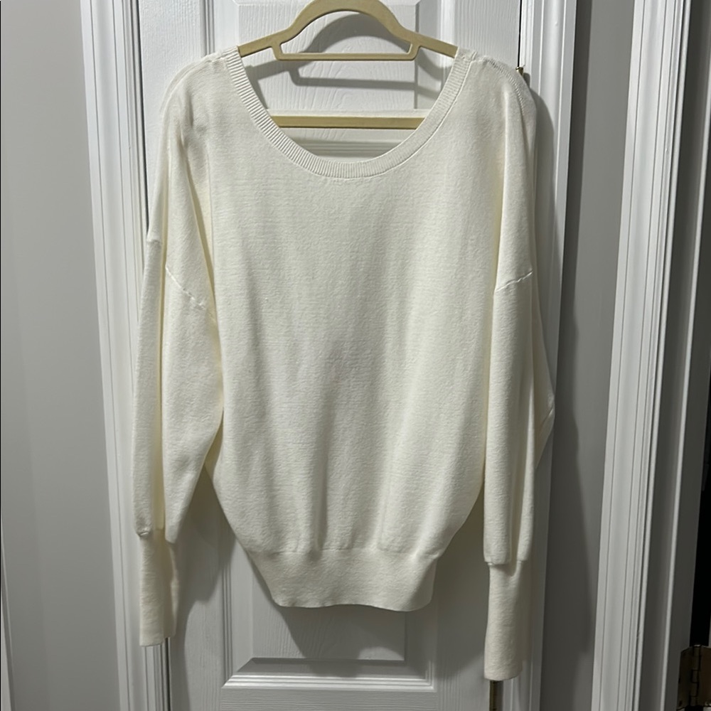 Cream Crew Neck Sweater with Relaxed Fit Ribbed Cuffs and Open Back